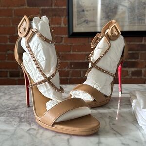 Brand new (never worn) Christian Louboutin pumps in nude with pink bronze studs